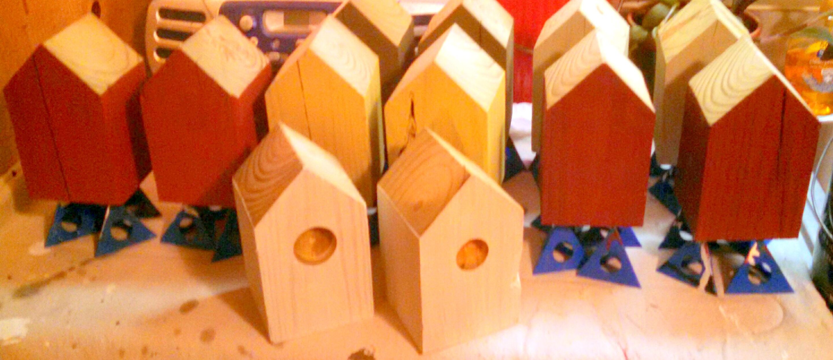 Birdhouses being painted