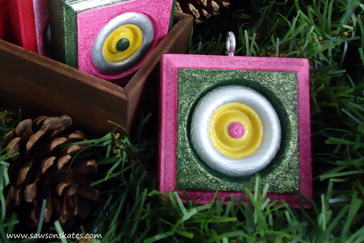 Wood rosettes are transformed into DIY Christmas ornaments. So easy and they make great gifts!
