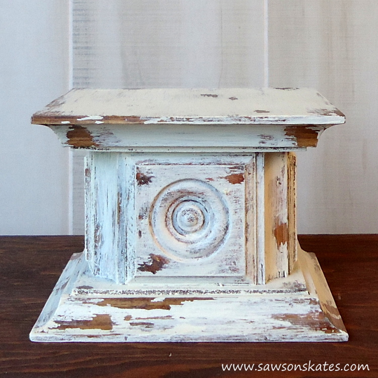 Scrap wood and an easy chippy paint finish come together for this chippy paint wood rosette DIY candle holder!
