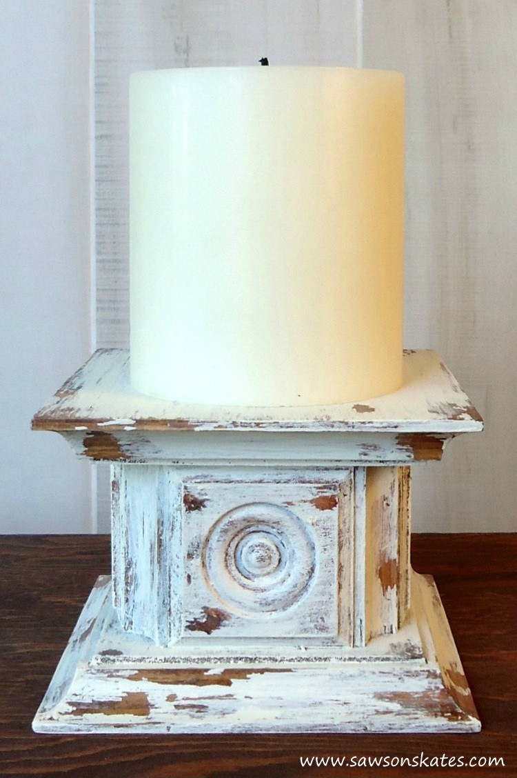 Looking for easy DIY candle holder ideas? Look no further than this antique style pillar candle holder featuring wooden rosettes and a chippy paint finish! Make it for yourself or give as a gift.