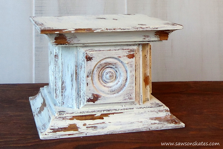 Scrap wood and an easy chippy paint finish come together for this chippy paint wood rosette DIY candle holder!