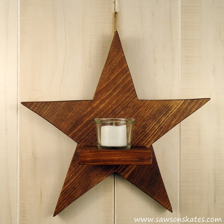 Who doesn't like stars, wood and candles? All three come together for this easy to make DIY rustic wood star sconce!