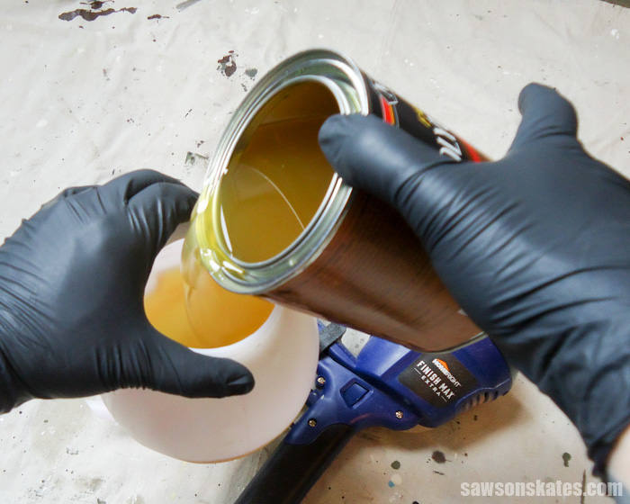 How to spray polyurethane - add the poly to the sprayer container