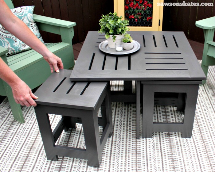 Easy DIY outdoor coffee table plan with 4 hidden side tables - the side tables easily pull out for more storage