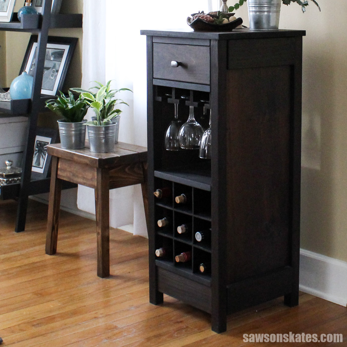 This DIY wine cabinet attractively displays entertaining essentials like wine bottles and wine glasses and a drawer provides a place to store accessories.