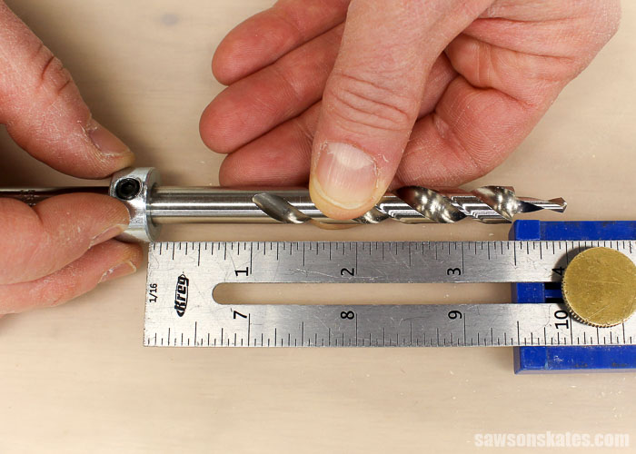 Slide the depth collar on the Kreg Jig Mini drill bit so that it touches the ruler of the Multi-Mark.