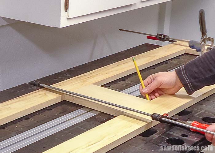 Marking the groove for the DIY door made with pocket holes