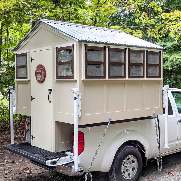 DIY truck camper at a campsite