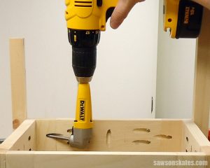 A right angle attachment allows a drill to fit into tight spaces