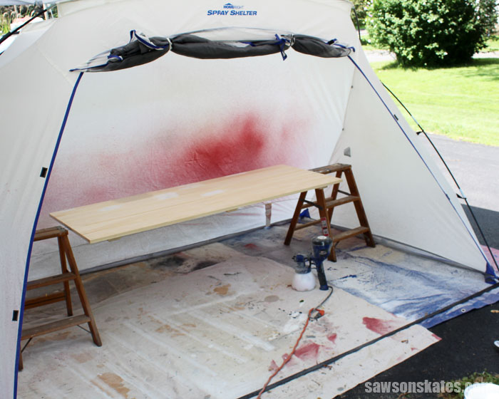 Use a spray shelter when you spray paint doors to protect surrounding objects from overspray