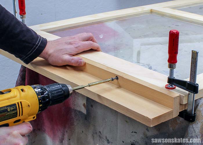 DIY wood storm windows can be installed with store bought hangers or DIY hangers