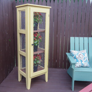 DIY outdoor enclosed plant stand on a deck