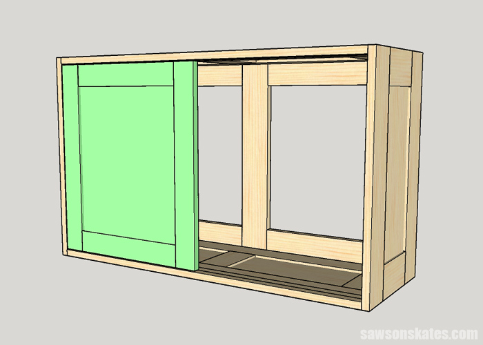 Installing the first sliding door in a DIY tool storage cabinet