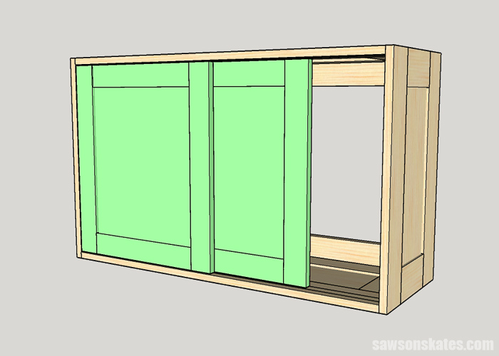 Installing the second sliding door in a DIY tool storage cabinet