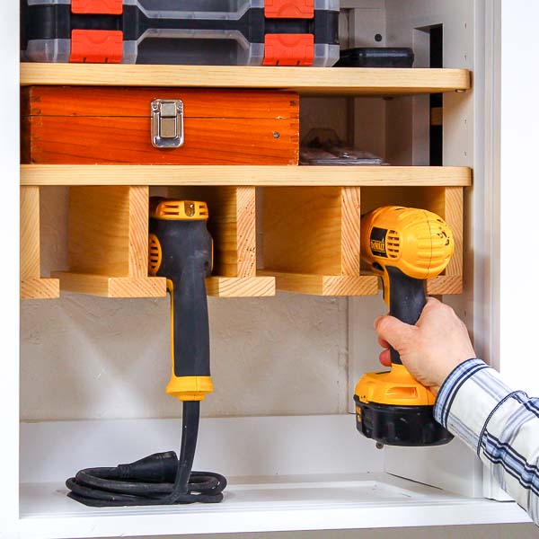 Placing a cordless drill into drill storage rack