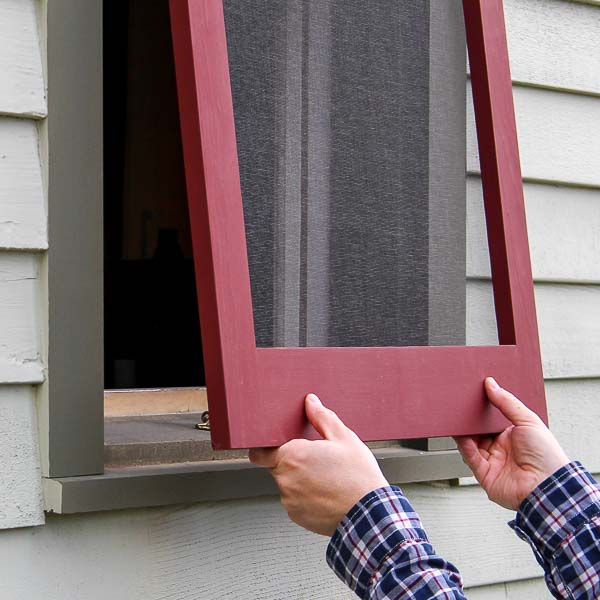 Installing a wood window screen frame in a window opening