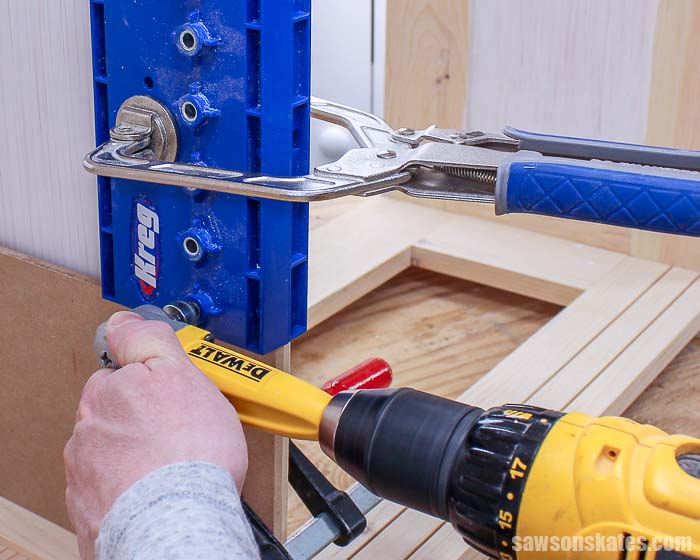 Using a drill to drill shelf pin holes to make adjustable shelves