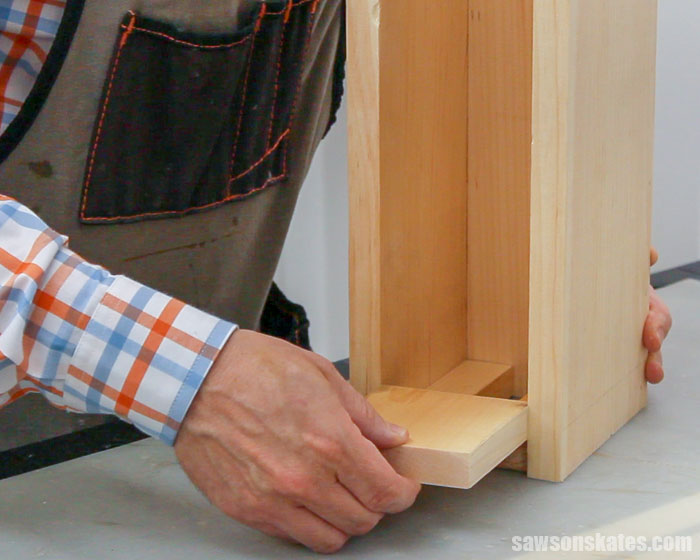 Attaching the wood bottom to a DIY butterfly box