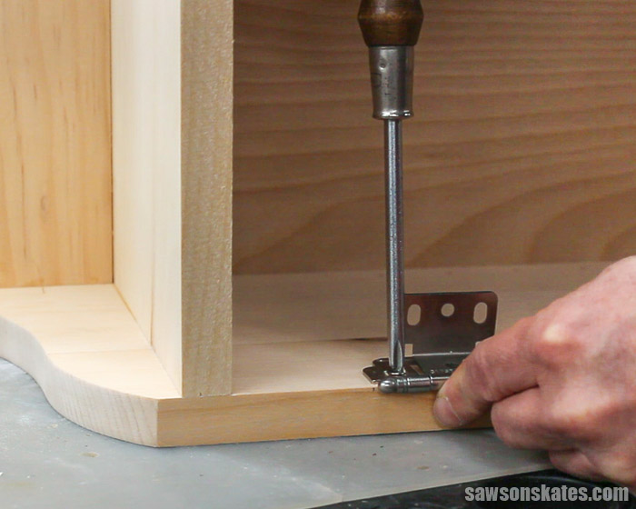 Attaching hinges to a DIY display cabinet