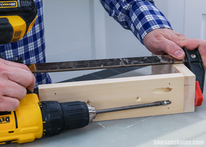 Using a drill to drive a pocket screw to assemble DIY shelf brackets