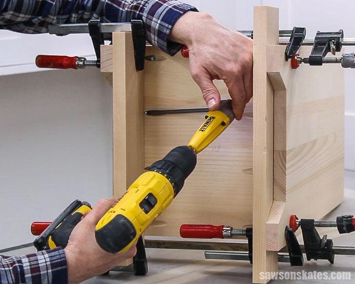 Attaching the bottom of DIY nightstand with drawers