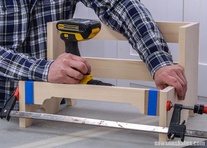 Attaching the front rails of an antique-inspired DIY step stool