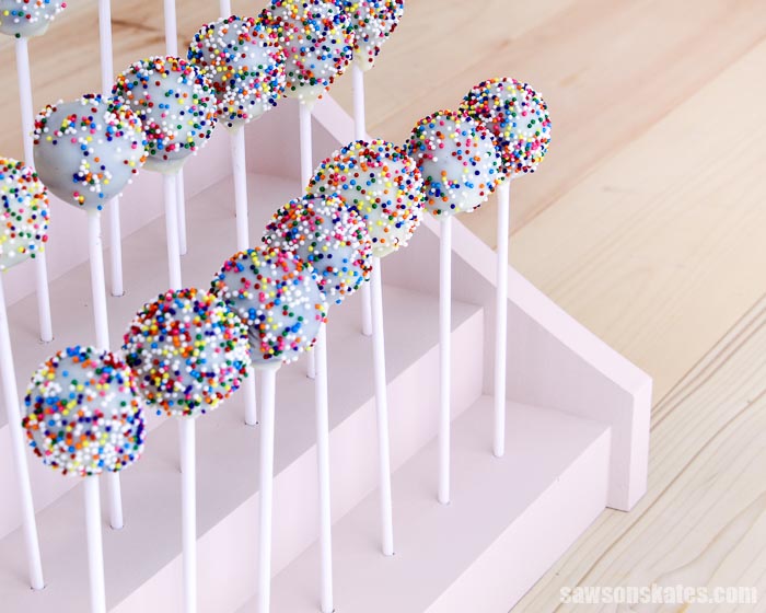 Angled view of cake pops displayed in a  3-tier DIY cake pop holder
