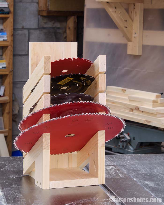 Front view of a DIY saw blade storage rack with five saw blades