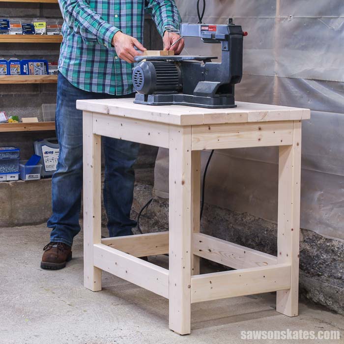 Using a scroll saw on top of a small DIY power tool stand