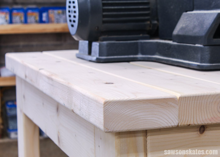 Top view of DIY power tool stand made with 2×4s