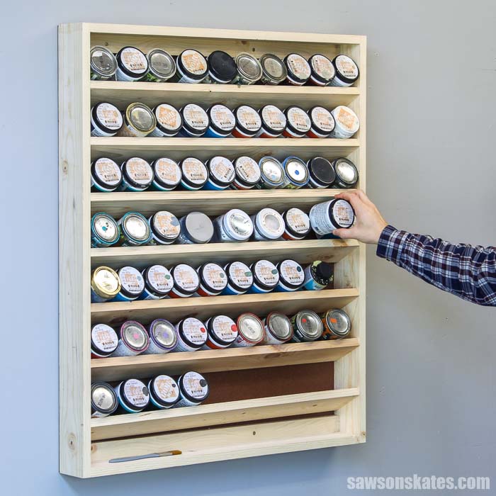Get organized with this DIY paint storage rack. This wall-mounted holder is easy to make and the perfect way to organize small paint containers.