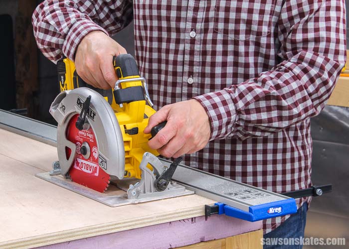 Cutting a piece of plywood with a circular saw