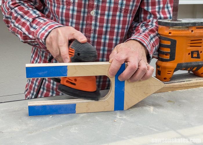 Using a mouse sander to smooth the inside edges of a DIY Christmas card holder