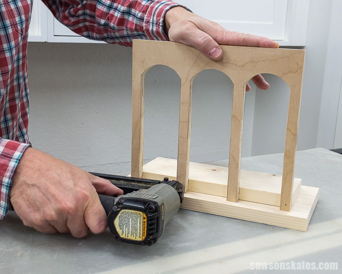 Using a brad nailer to attach the sides for a DIY Christmas card holder