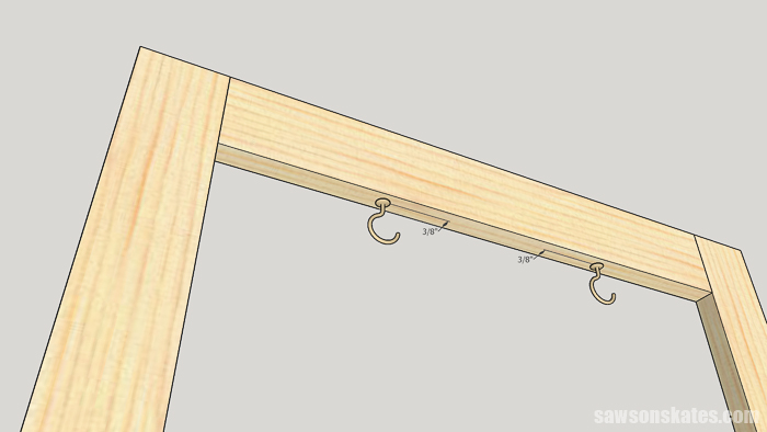 Diagram showing where to position the cup hooks on a DIY stocking holder stand