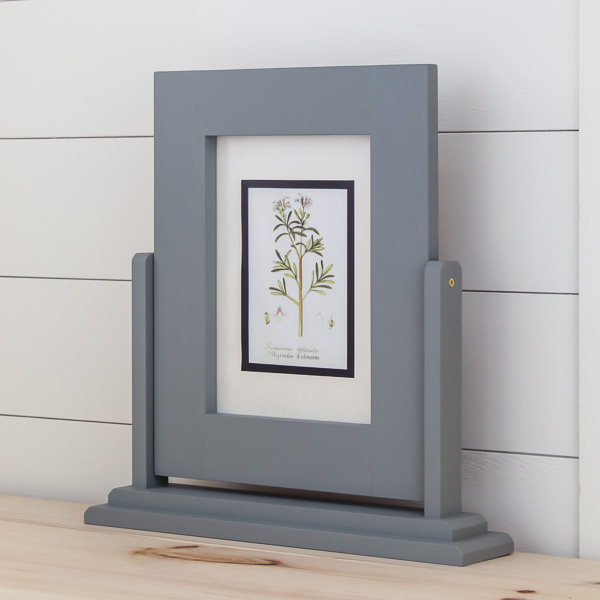 Blue tilting picture frame on a table
