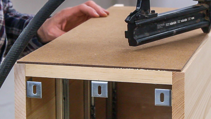 Table top expansion brackets that join the sides to the desktop