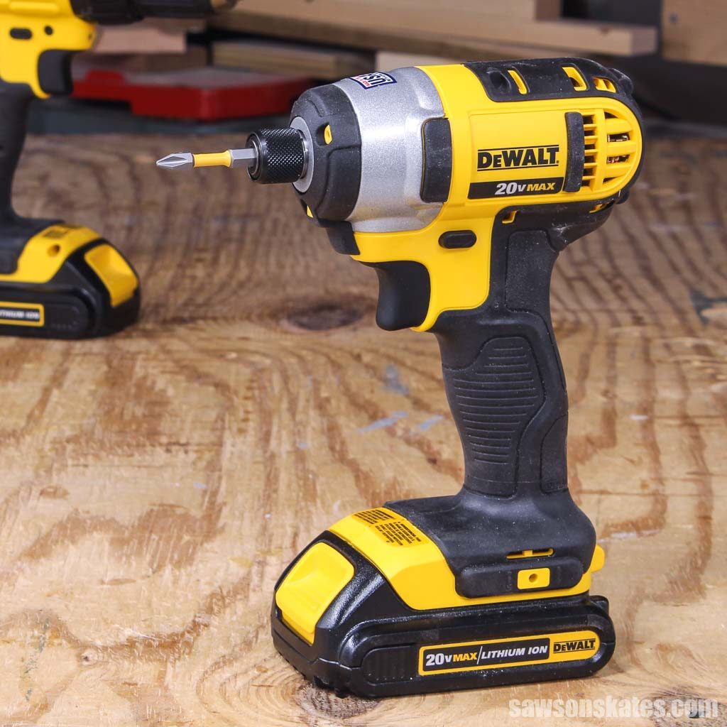 Impact driver sitting on a wood workbench
