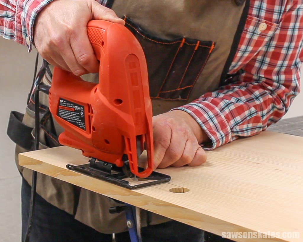 Using a jigsaw to cut out a handle for a DIY lap desk