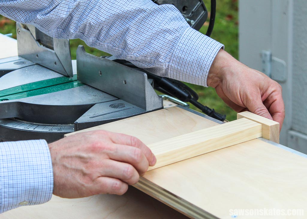Hand adjusting the stop for repeatable cuts on the support wing of mobile DIY miter saw stand