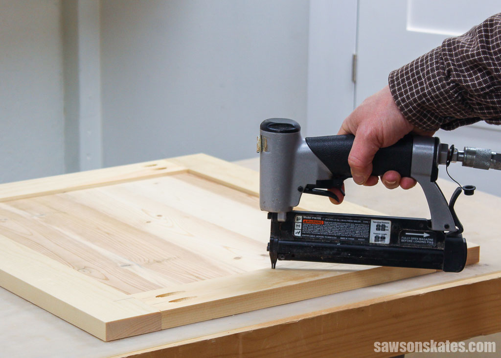 Using a pin nailer to hold a center panel in place