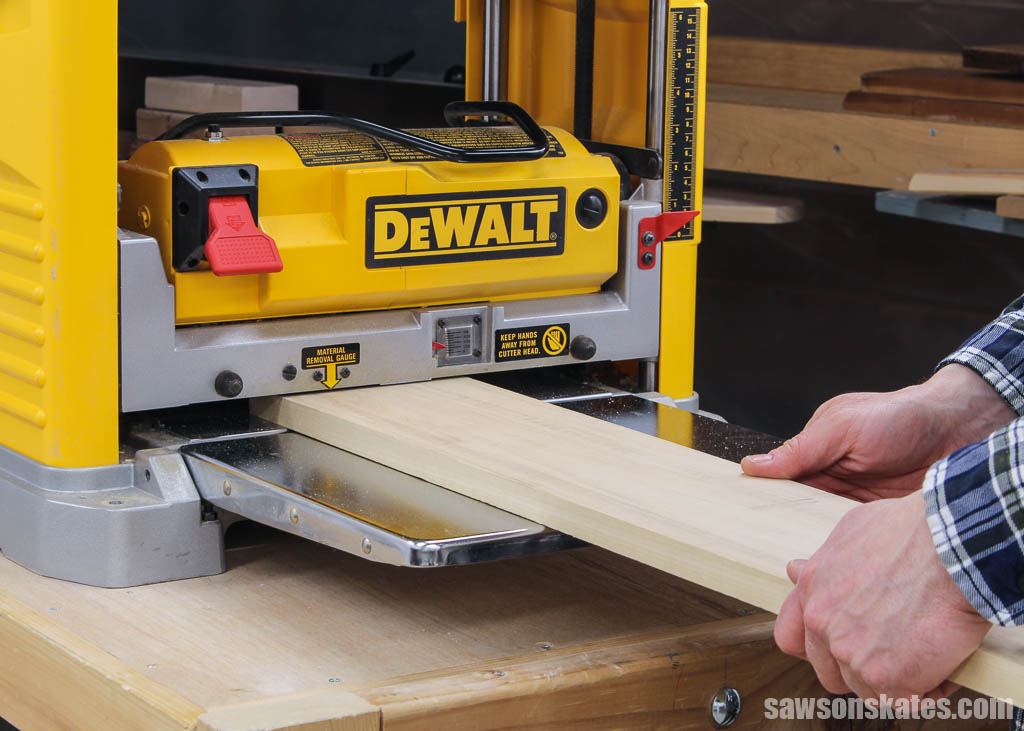 Feeding board into a thickness planer
