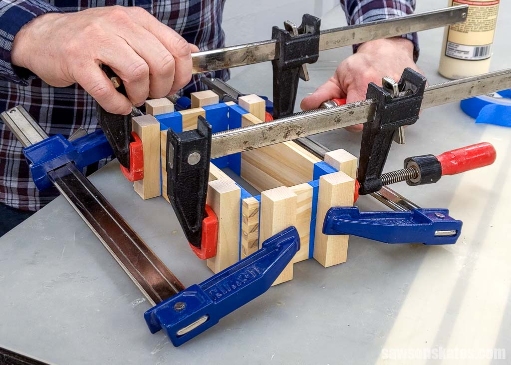 Using clamps to assemble a box made with box joints