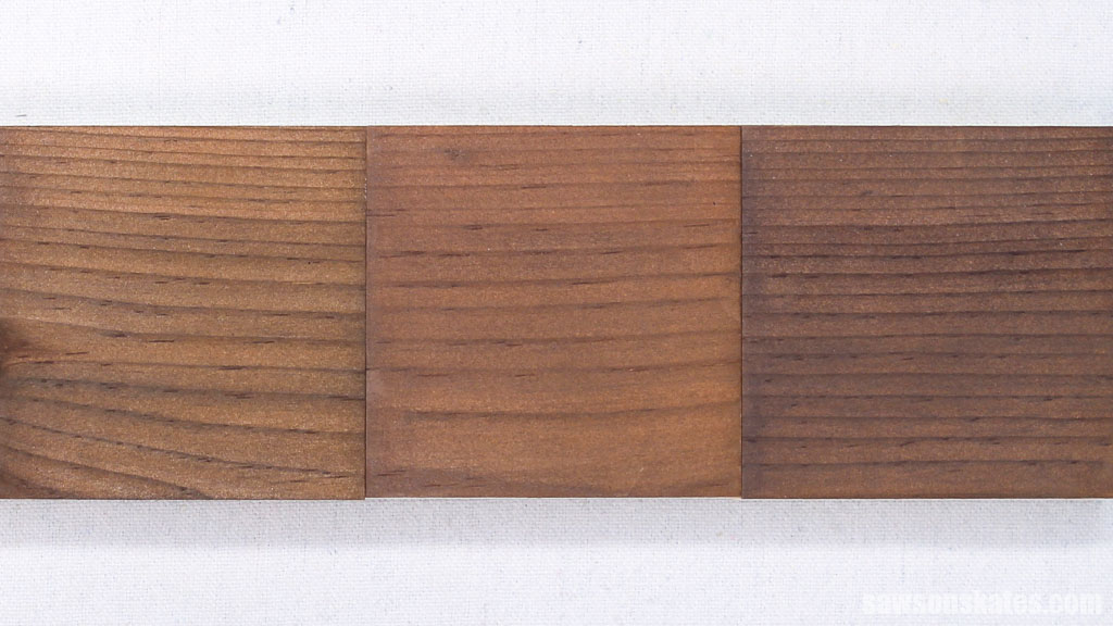 Three pieces of wood that were stained with a homemade natural wood stain