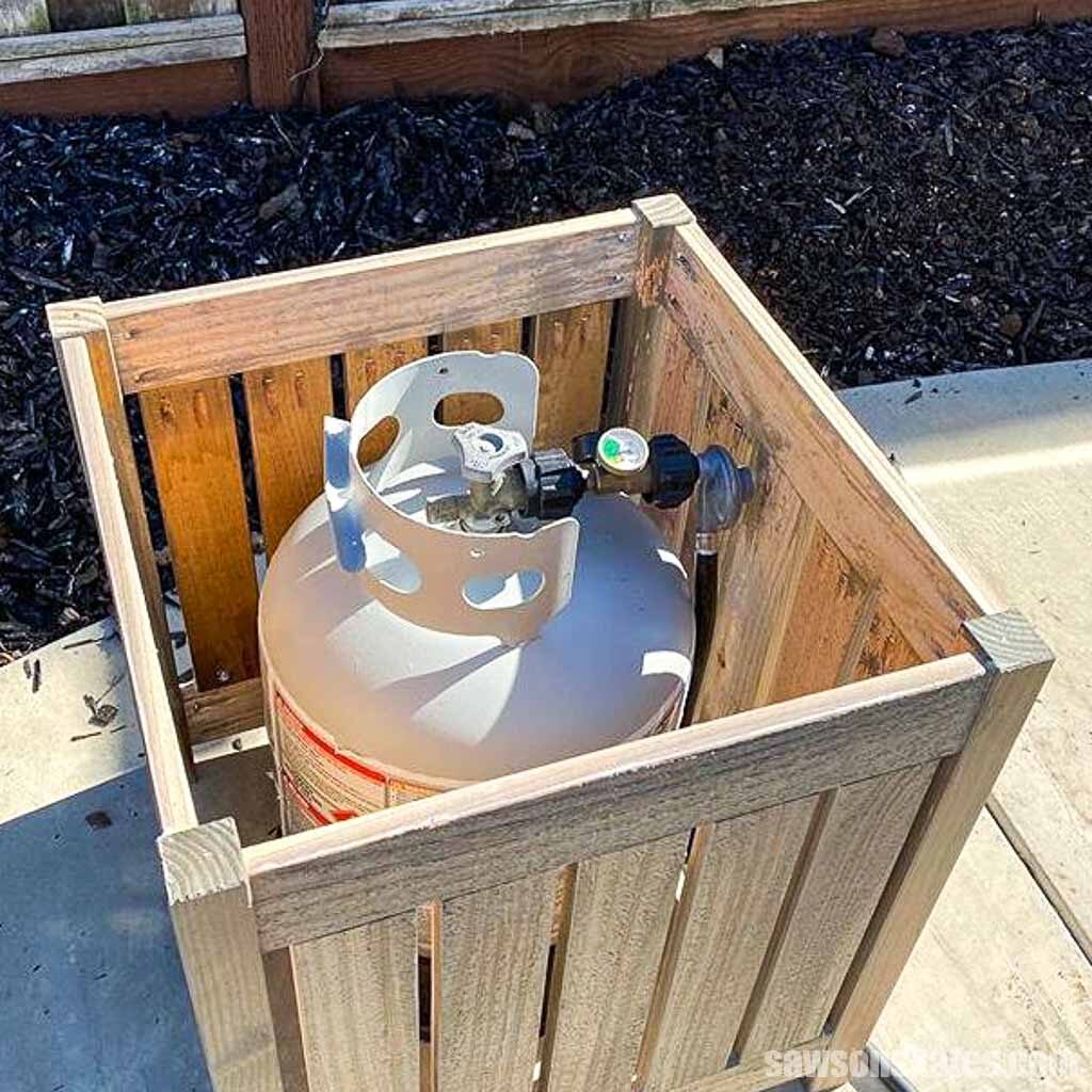 DIY outdoor side table being used to hide a propane tank