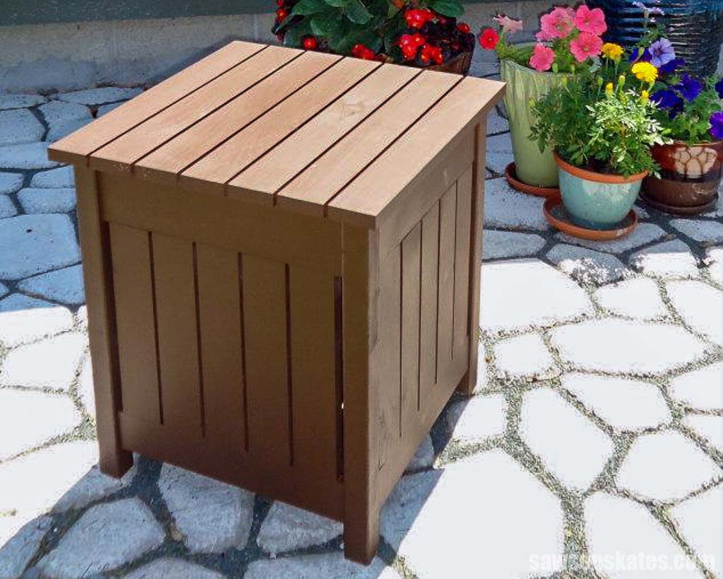 DIY outdoor side table on a stone patio