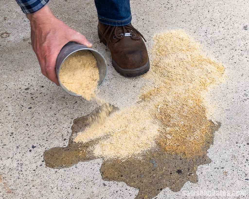 Using sawdust to clean up a spill