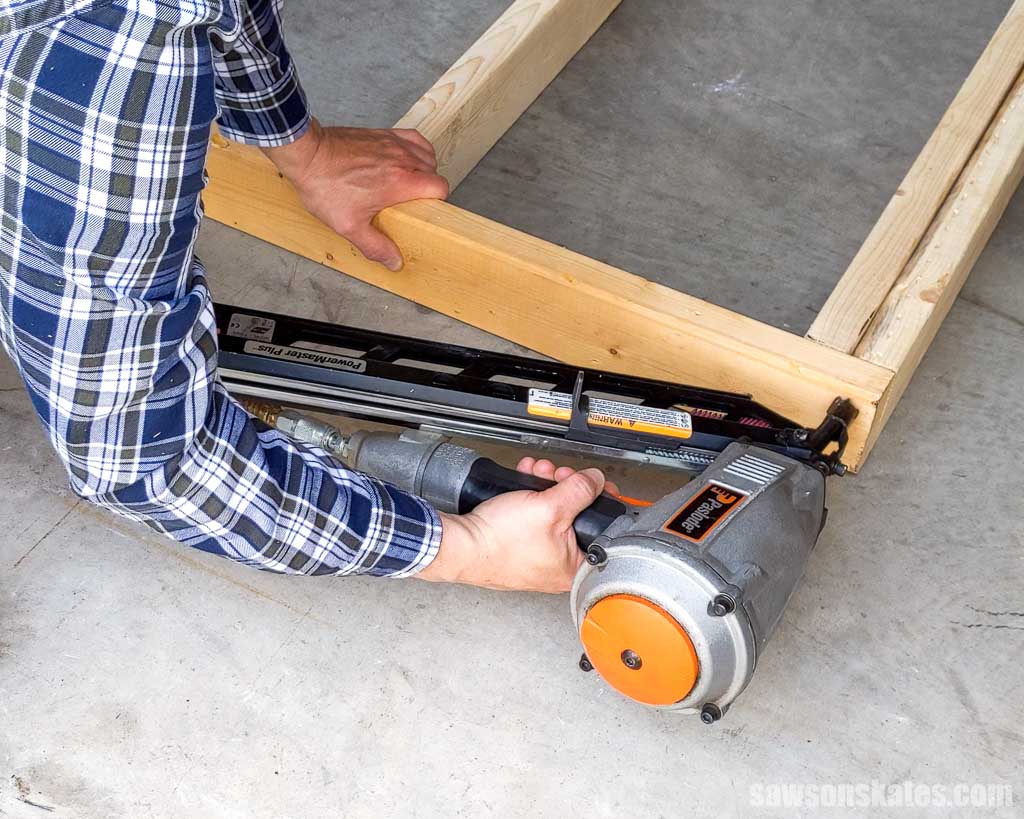 Using a framing nailer to join 2×4s for a wall