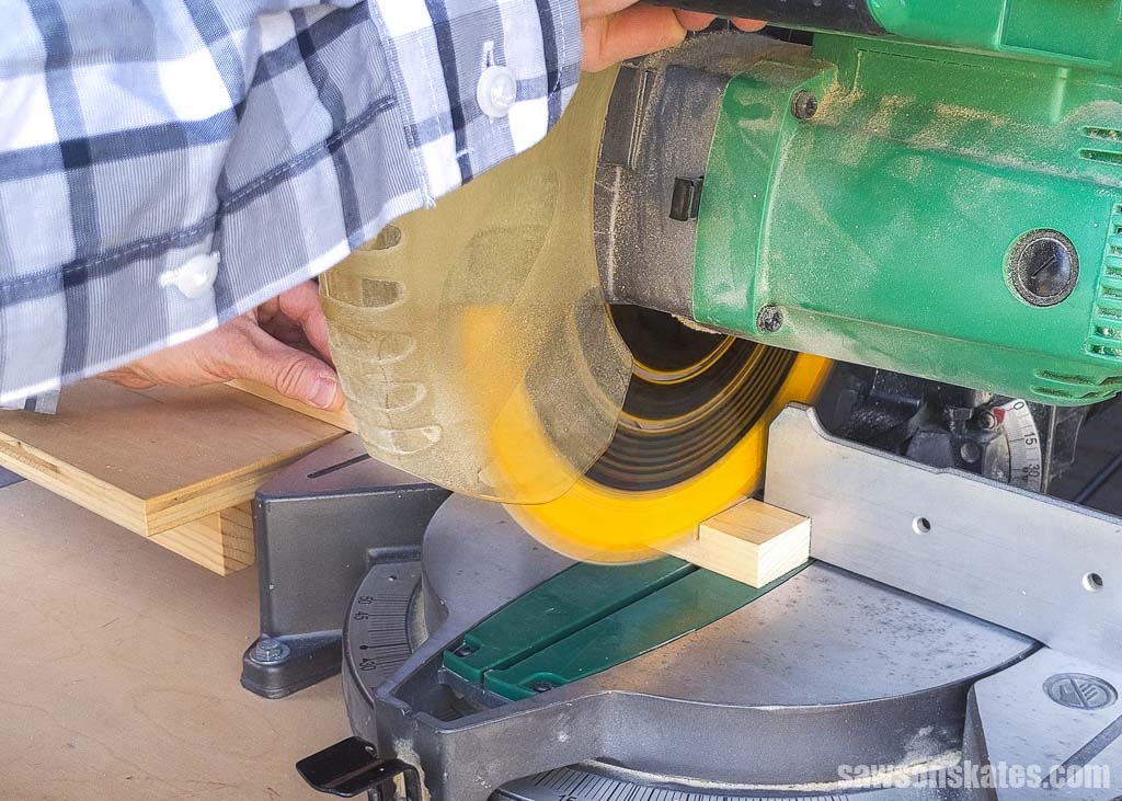 Making a crosscut with a miter saw