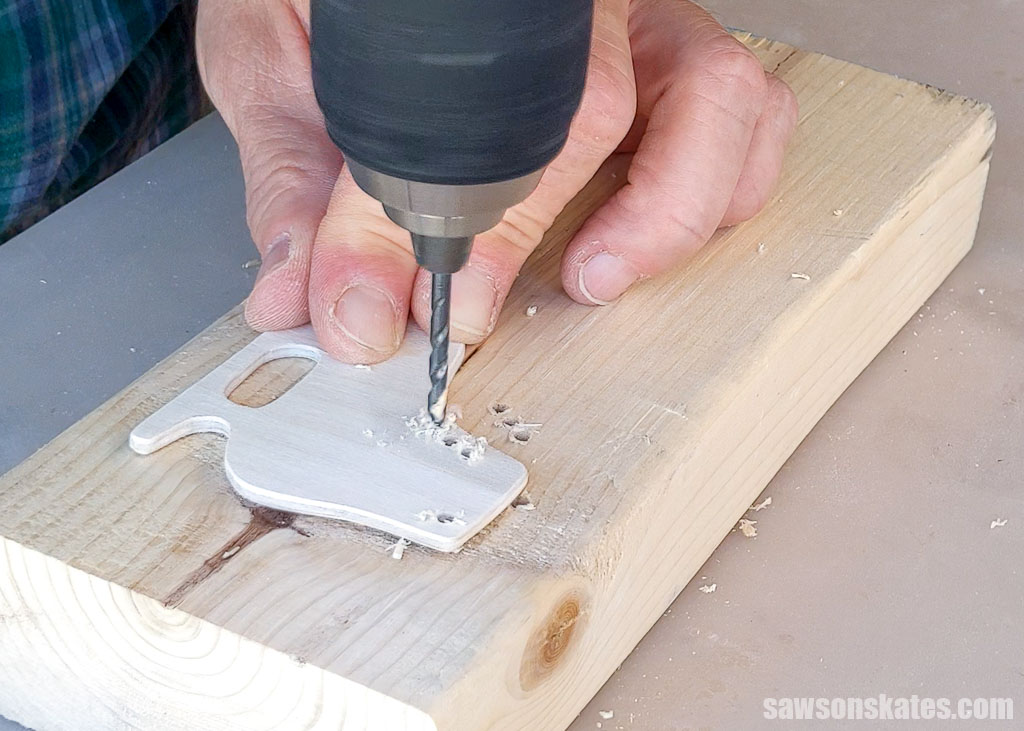 Drilling holes for laces and a hanger on a DIY ice skate Christmas ornament